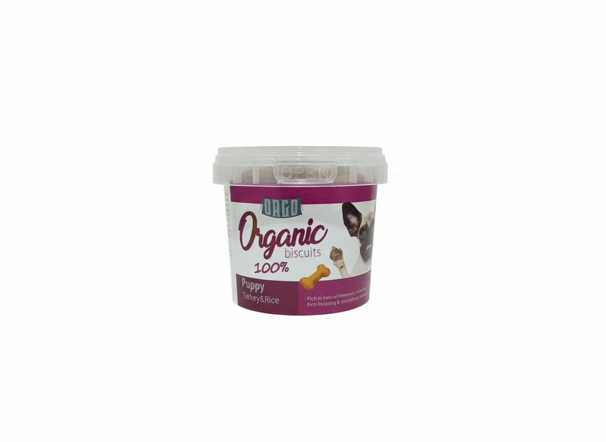 Container of organic puppy biscuits on a white background